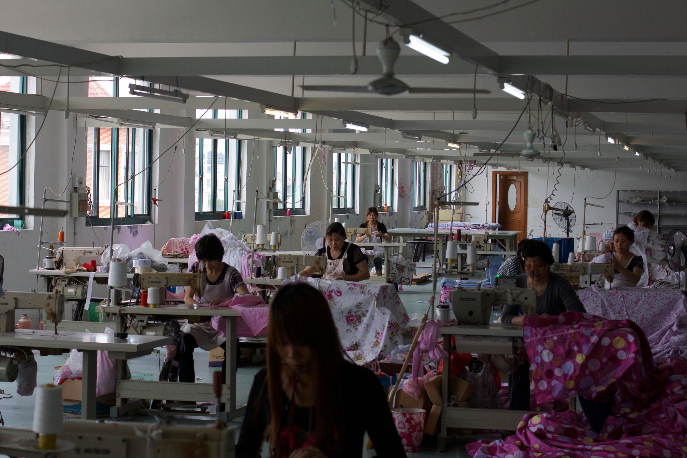 Textile workers at sewing machines in China — industry reference photograph